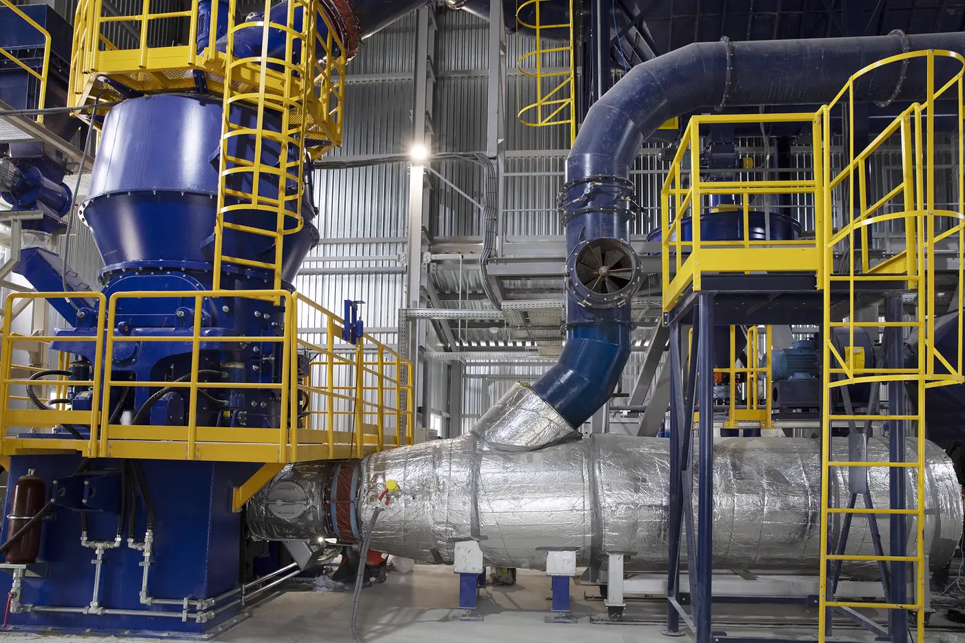 Industrial boiler plant with yellow walkways