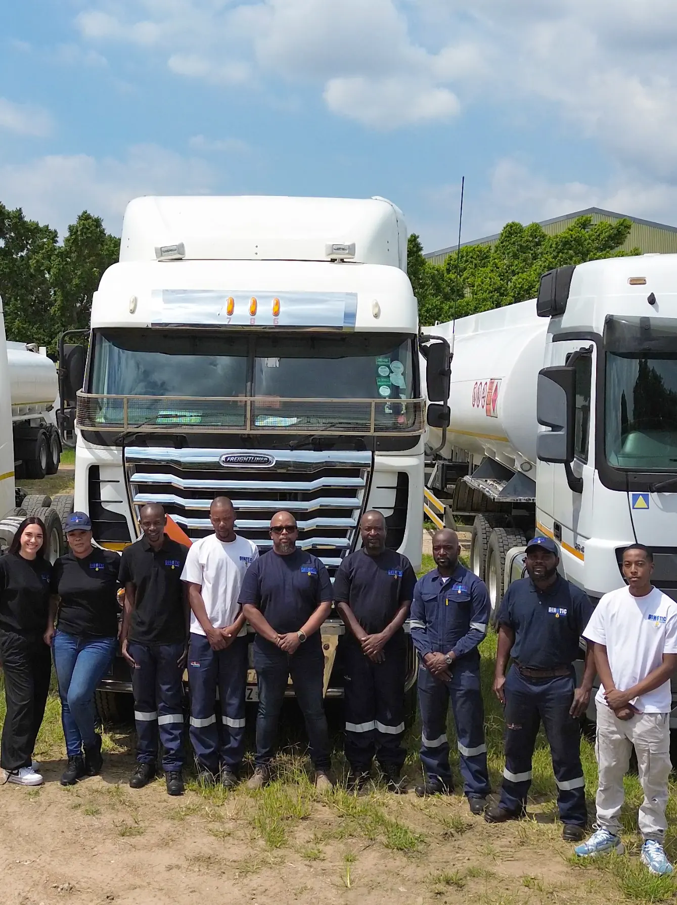The Dinotic Energy team in front of their tanker fleet